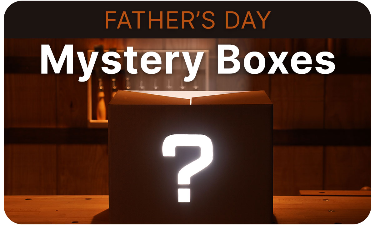 A closed box with a question mark on a work bench in a dark room