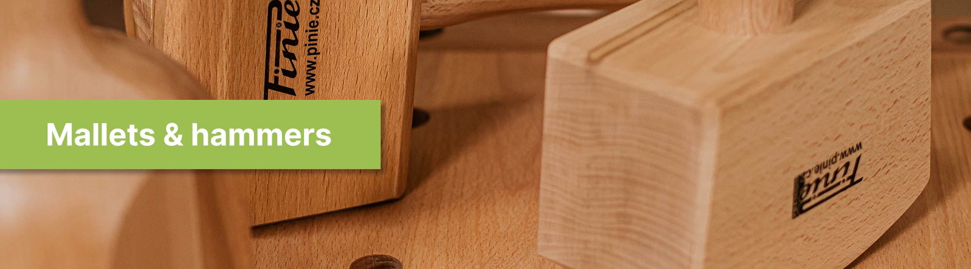 wooden pinie mallets and hammers on a wooden bench